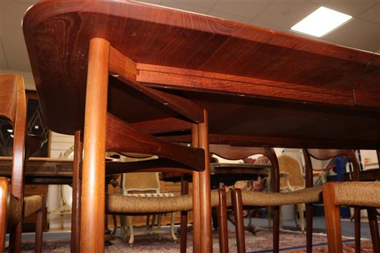 A Danish teak extending dining table designed by Peter Hvidt & Orla Mølgaard Nielsen for France and Daverkosen and ten Dutch manufactur